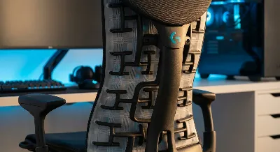 Herman Miller x Logitech G Embody Gaming Chair's unique pixelated back support system in a gaming room.