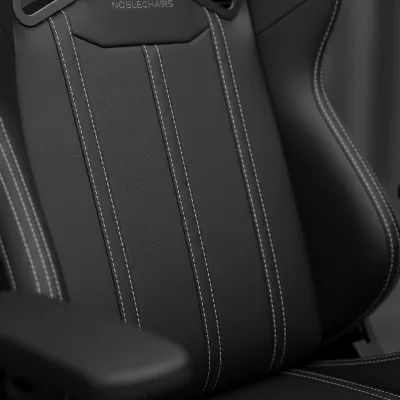 Close-up of Noblechairs Hero real leather and stitching detail, emphasizing craftsmanship